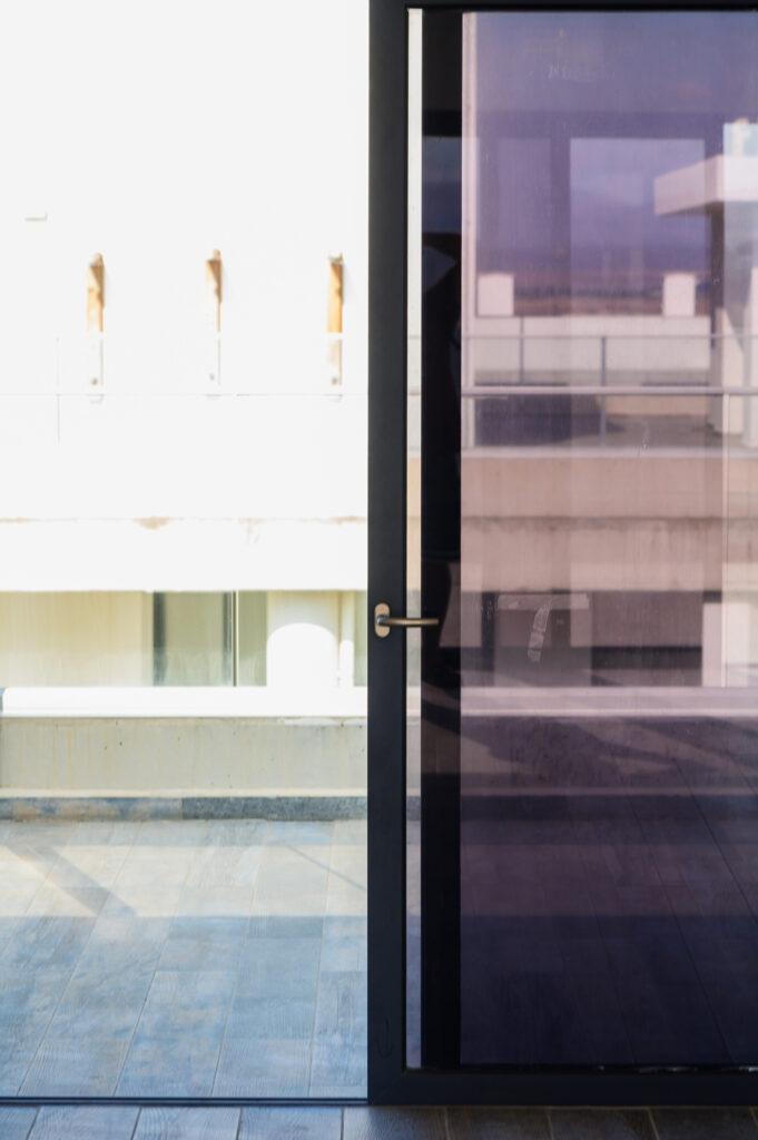 vecteezy_a-sleek-modern-door-opens-to-reveal-a-bright-sunlit-balcony_51976455 (1)